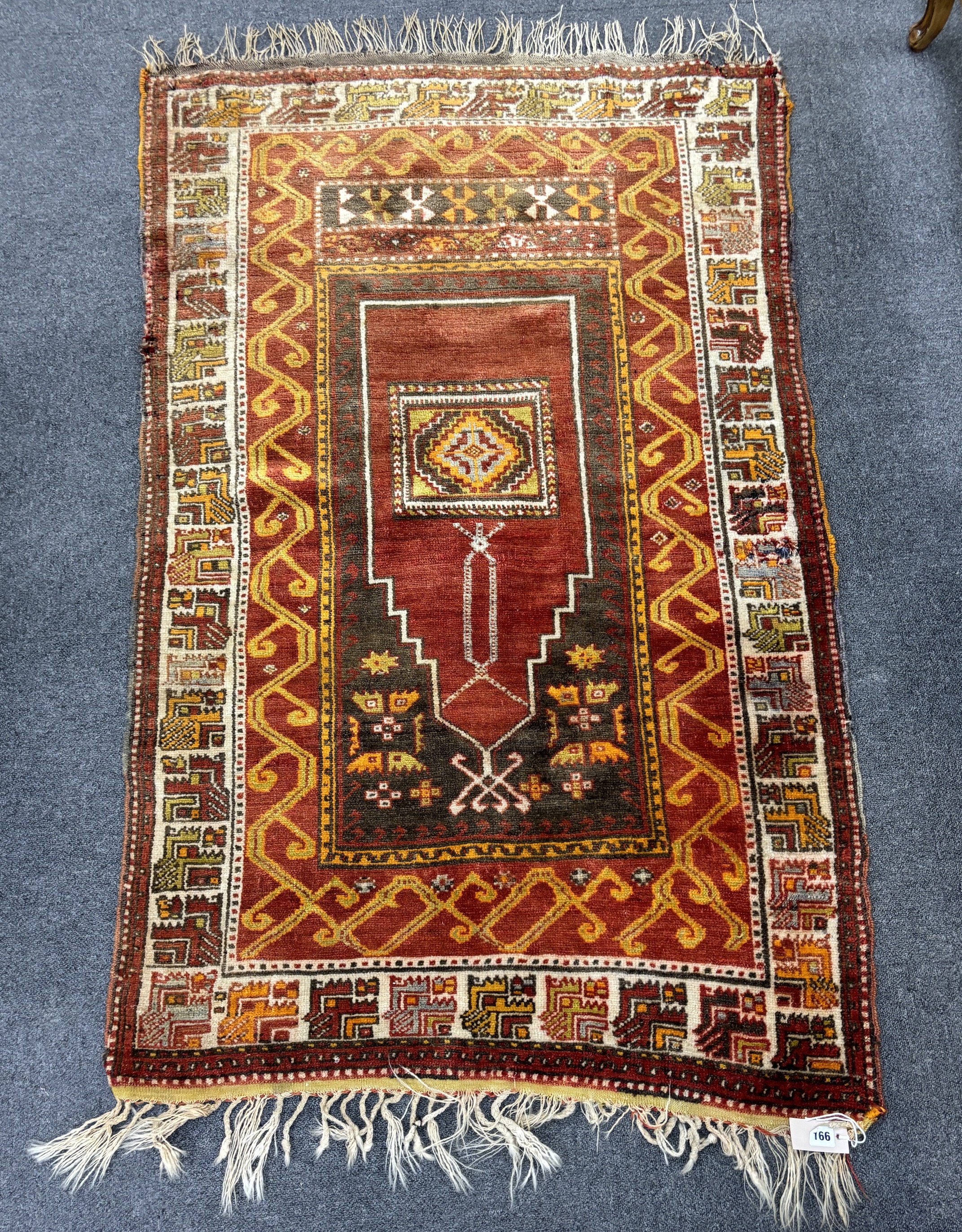 A Turkish prayer rug, 154 x 96cm
